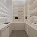 Modern White Minimalist Laundry Room With Sink Washing Machine Shelves Holding Towels And Bottles