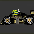 John Player Special Black Racing Car With Gold Logos Yellow Helmet And Large Tires