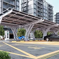 Solar Canopy Covered Parking Lot with EV Charging Stations Near High Rise Buildings and Greenery