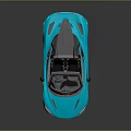 Blue Convertible Sports Car With Sleek Design And Alloy Wheels On Reflective Surface