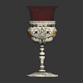 Decorative Furniture Accent with Red Glass Shade and Silver Ornate Base Featuring Detailed Decorative Patterns