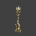 Ornate Golden Decorative Candelabra With Multiple Candle Arms And Figural Base