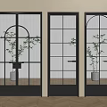 Modern Swing Doors With Black Frames Glass Panels And Indoor Plants