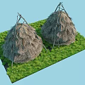 Two Thatched Huts With Conical Straw Roofs On Green Grassy Area