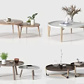 Stylish Modern Coffee Tables With Round Tops Wooden Legs And Decorative Plants
