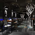 Modern Industrial Style Restaurant Interior With Pendant Lights Tables Chairs And Art Decor