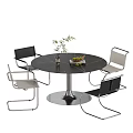 Modern Black Round Dining Table with Metal Frame Chairs and Vase Fruit Plate