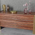 Striped Wooden Console Cabinet With Gold Legs Drawers And Decorative Vases On Gray Floor