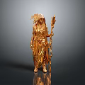 Golden Woman Statue In Ornate Clothing With Feather Headdress Holding Long Staff