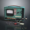 Vintage Computer Device With Green Case Display Screen Buttons Knobs And Connecting Cables