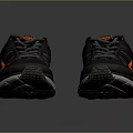 Black and Orange Athletic Running Shoes with Red Sole and Mesh Upper Design