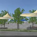 Tensile Membrane Structures In Outdoor Area With Trees Outdoor Tables And Blue Sky