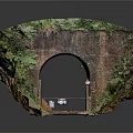 Road Infrastructure Featuring Brick Tunnel Entrance With Metal Gate Warning Signs And Green Vegetation