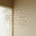 Modern Geometric Metal Frame Chandelier With Multiple Small Lights In Living Room Interior