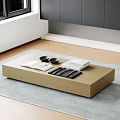 Modern Wooden Coffee Table on Gray Rug with Books Bowls and Black Coasters Near Window