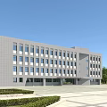 Modern Office Building Exterior With Gray Facade Large Windows And Landscaped Front Plaza