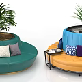 Colorful Circular Public Chairs With Cushions Plants And Side Table Setup
