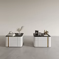 Modern Bedside Tables with White Bodies Black Tops Gold Accents and Decorative Books Plant Frame