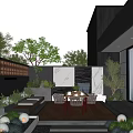 Modern Courtyard Garden With Wooden Deck Dining Table Chairs Green Plants Stone Steps And Lighting
