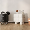 Black And White Decorative Cabinets With Drawers Wheels Cubes Figurine And Cards On Wooden Floor