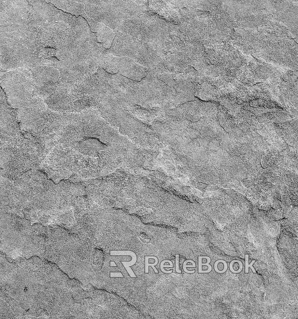 A rugged, gray-brown boulder textured with rough, uneven surfaces and cracks, set against a blurred background.