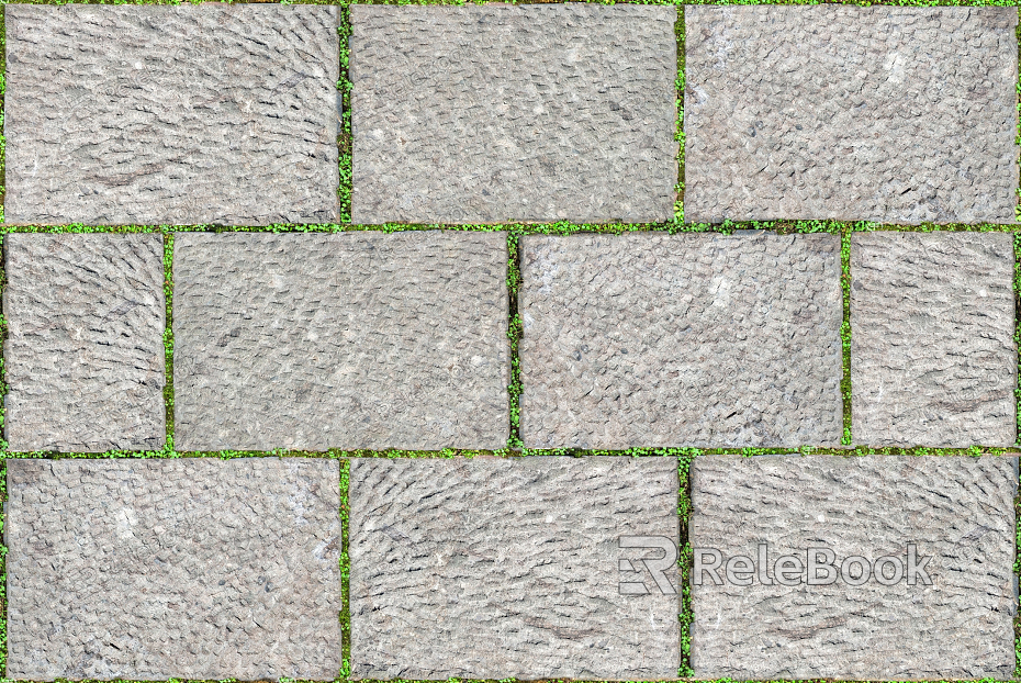 Close-up of stone paving, featuring a textured surface with irregular, interlocking stones of various shades, creating a rustic and durable pathway material.