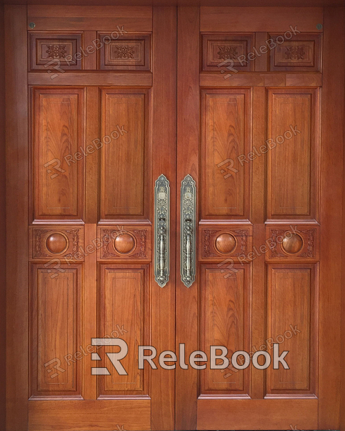 A rustic wooden door with intricate, carved designs and a weathered texture, adorned with a simple, circular metal handle, set against a backdrop of lush greenery.