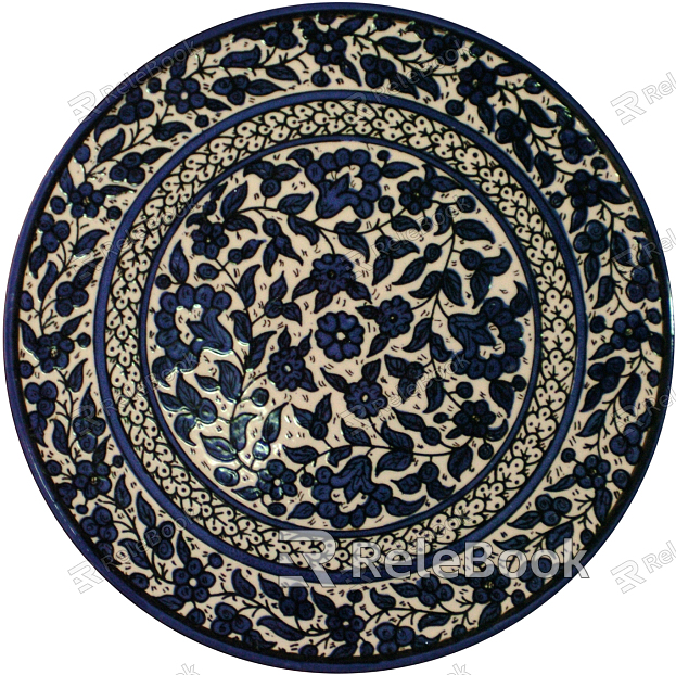 A round, white ceramic plate with a delicate blue floral pattern along the rim, showcasing oriental aesthetics.