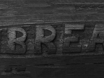 Dark brown solid wood carved bread logo 3d model