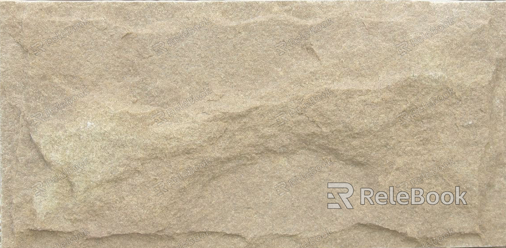 A close-up of a rugged, gray rock surface with deep crevices and uneven texture, illuminated by soft, diffused light that highlights its natural patterns and mineral composition.