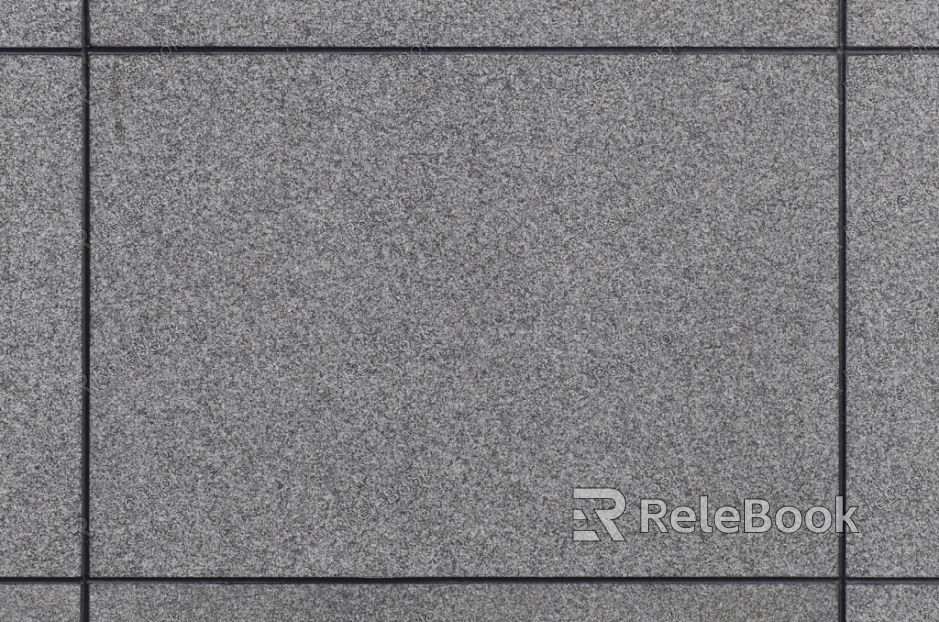 A close-up texture shot of granite, showcasing its characteristic flecks of white, grey, and black in a rugged, natural pattern. The stone's polished surface reflects light, highlighting its depth and complexity.