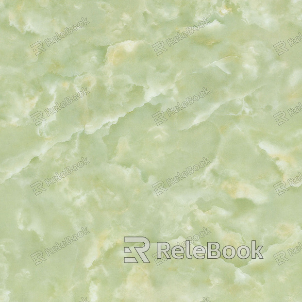 A close-up image of a marble texture, showcasing intricate veining in shades of white, grey, and black against a smooth, polished stone background.