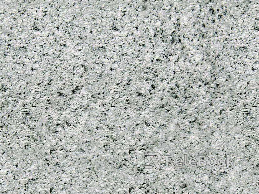 A close-up texture shot of granite, showcasing its characteristic flecks of white, grey, and black in a rugged, natural pattern. The stone's polished surface reflects light, highlighting its depth and complexity.