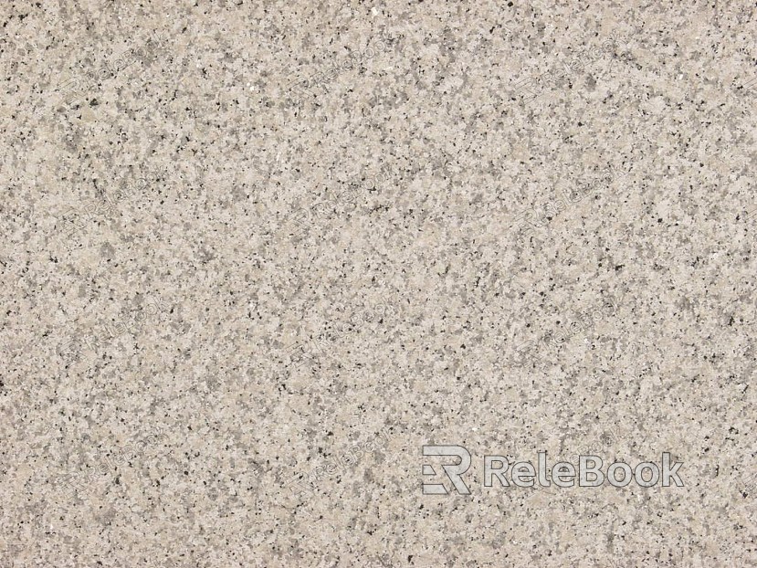 A close-up texture shot of granite, showcasing its characteristic flecks of white, grey, and black in a rugged, natural pattern. The stone's polished surface reflects light, highlighting its depth and complexity.