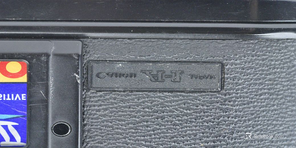 Black fine-grain leather camera body finish texture