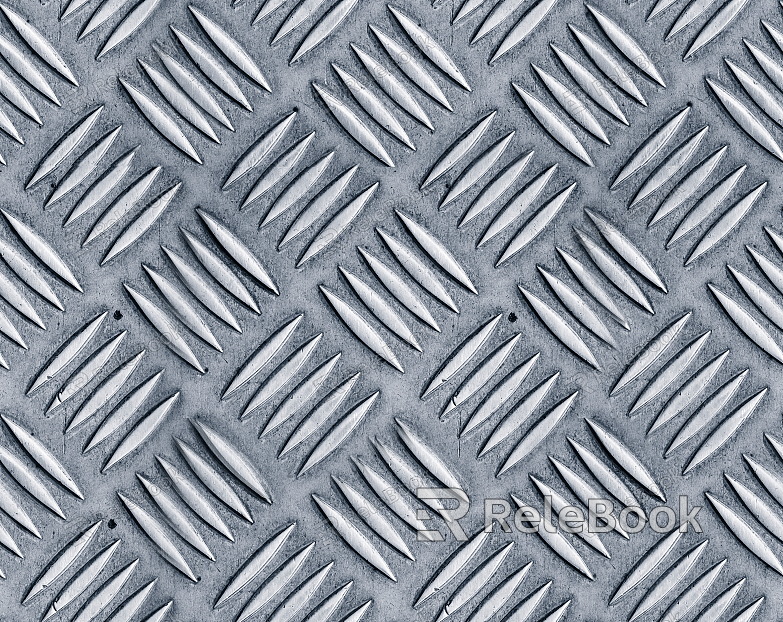 The image depicts a diamond plate, characterized by its distinctive raised diamond pattern on a flat surface, typically used for slip-resistant flooring or decorative purposes. It showcases a metallic silver finish with a clear, reflective sheen.