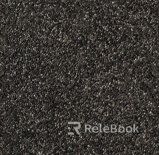 A gritty, textured image of gravel, showcasing small stones and pebbles in various shades of gray and brown, set against a backdrop of what appears to be a concrete or asphalt surface.