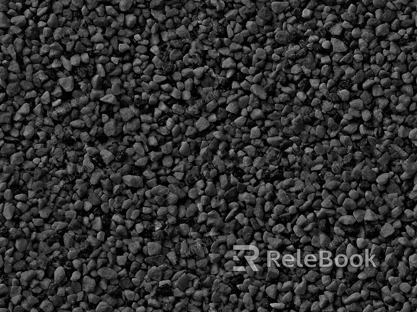 The image depicts a close-up of gravel, showcasing a mix of small stones and pebbles in various shades of gray, brown, and black, set against a dark background.