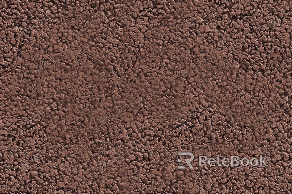 A coarse, granular material, predominantly composed of rounded rocks and pebbles, varying in shades of gray and brown, scattered across the surface, evoking a rugged, natural ambiance.