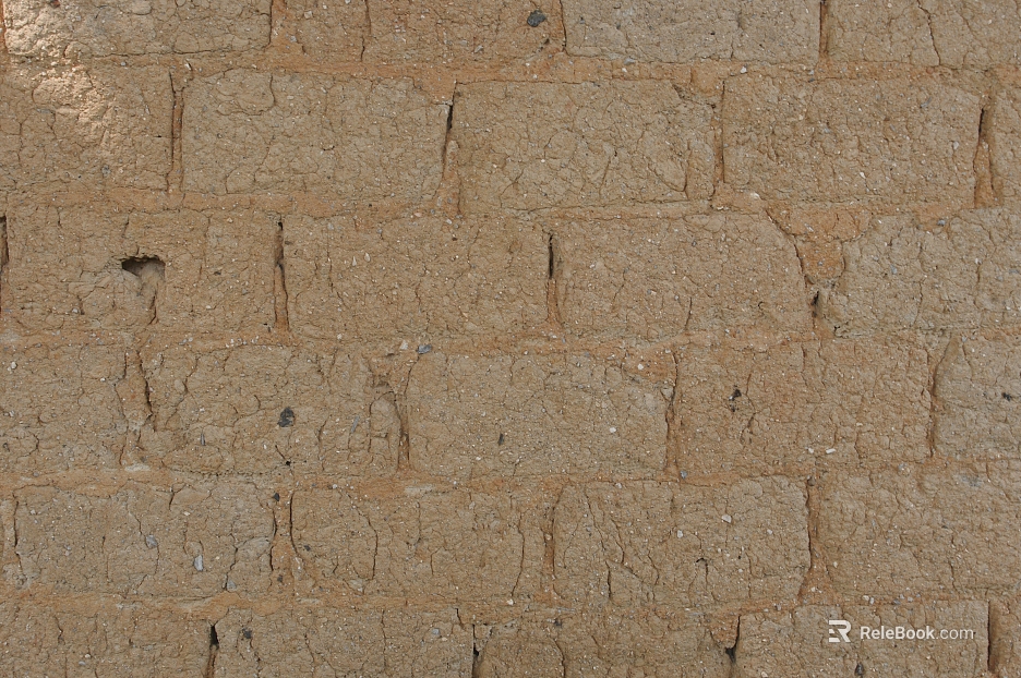 Yellow mud adobe brick village exterior wall texture
