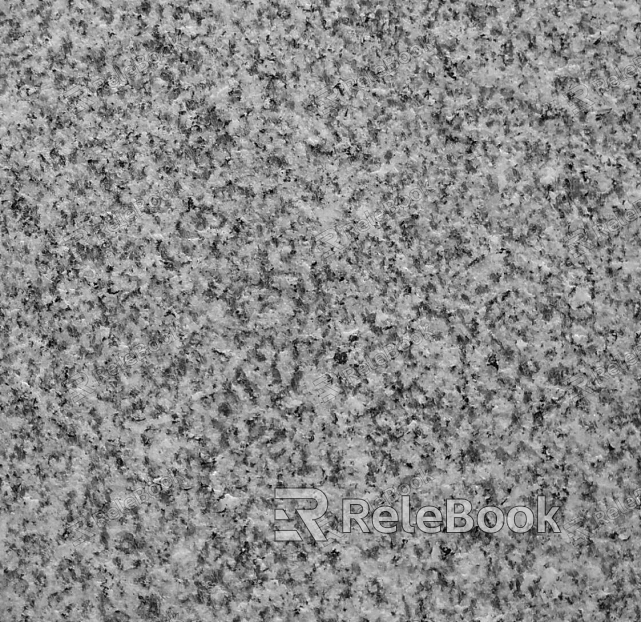 A close-up texture shot of granite, showcasing its characteristic flecks of white, grey, and black in a rugged, natural pattern. The stone's polished surface reflects light, highlighting its depth and complexity.