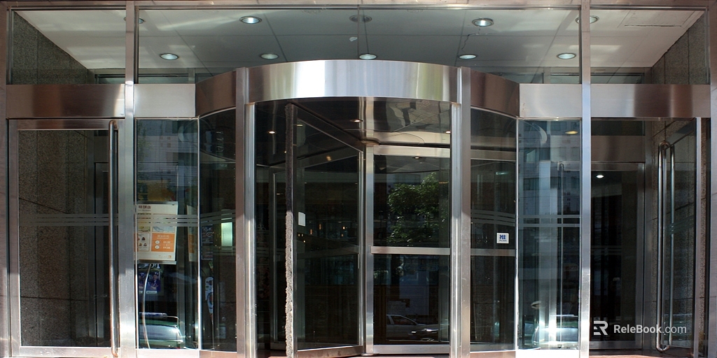 Modern silver gray glass revolving door commercial entrance texture