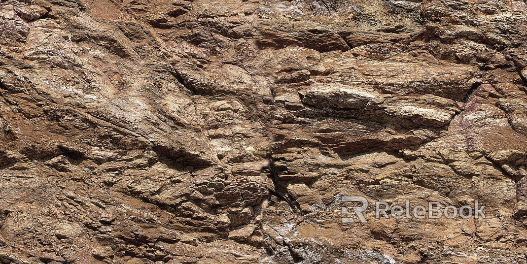 A close-up of a rugged, gray rock surface with cracks and mineral speckles, resembling a section of a boulder or natural stone formation.