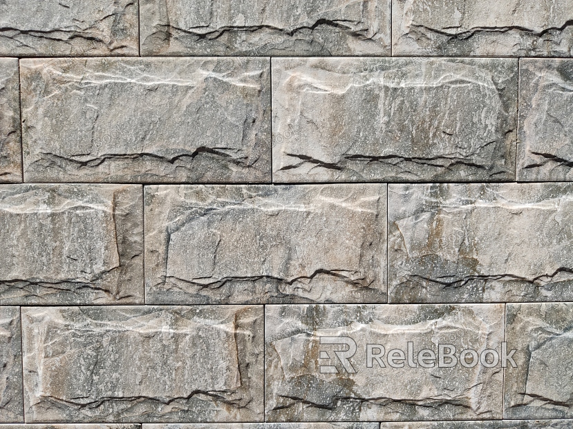 A textured brick wall in shades of red and orange, with signs of weathering and age, showcasing a rough, uneven surface and cracks between the bricks.