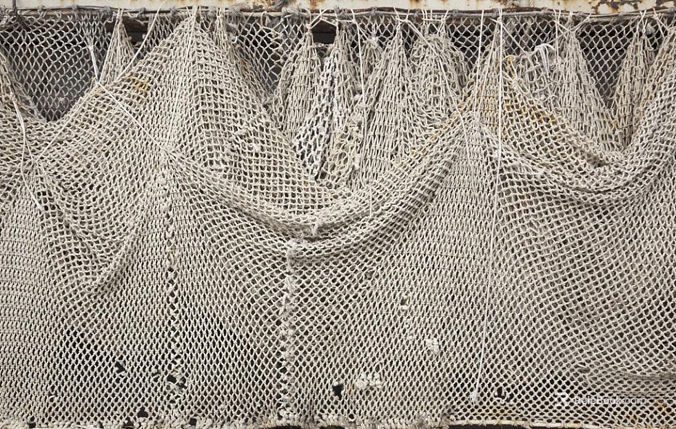 Off-white woven fishing net for outdoor protection texture