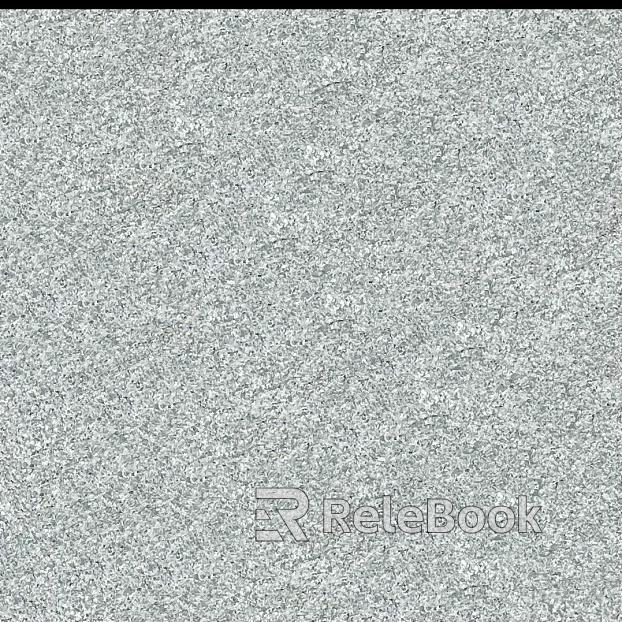 Close-up of a granite surface, revealing its characteristic speckled texture with prominent mineral grains in shades of grey, black, and white, embedded in a lighter matrix.