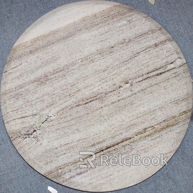 A close-up of a marble surface, showcasing its intricate web of grey and white veins swirling against a backdrop of deep, rich blue, evoking a sense of elegance and depth.