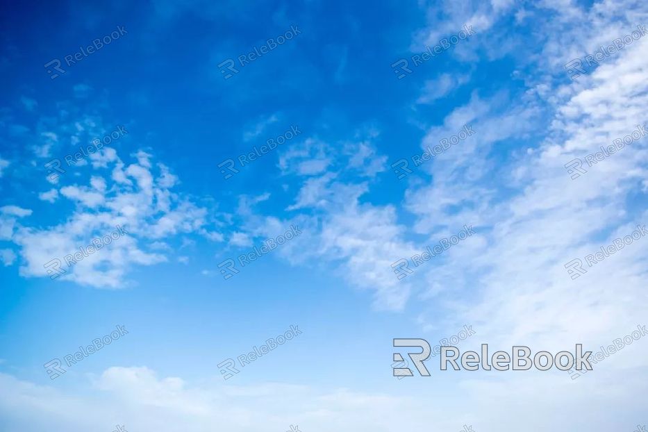 A solitary tree stands tall amidst a sea of golden wheat, basking under a vast, cloud-dappled sky. The scene exudes tranquility and the beauty of nature's simplicity.