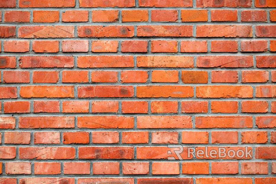 A textured brick wall in shades of red and orange, featuring uneven surfaces and cracks, conveying a sense of age and character.