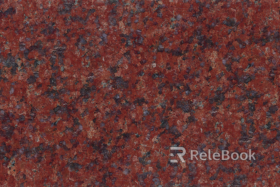 Close-up of a granite surface, revealing its characteristic speckled texture with prominent mineral grains in shades of grey, black, and white.